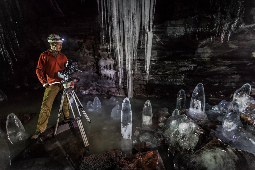 Filmmaker Steve Bumgardner films inside the Crystal Ice Cave at Lava Beds National Monument